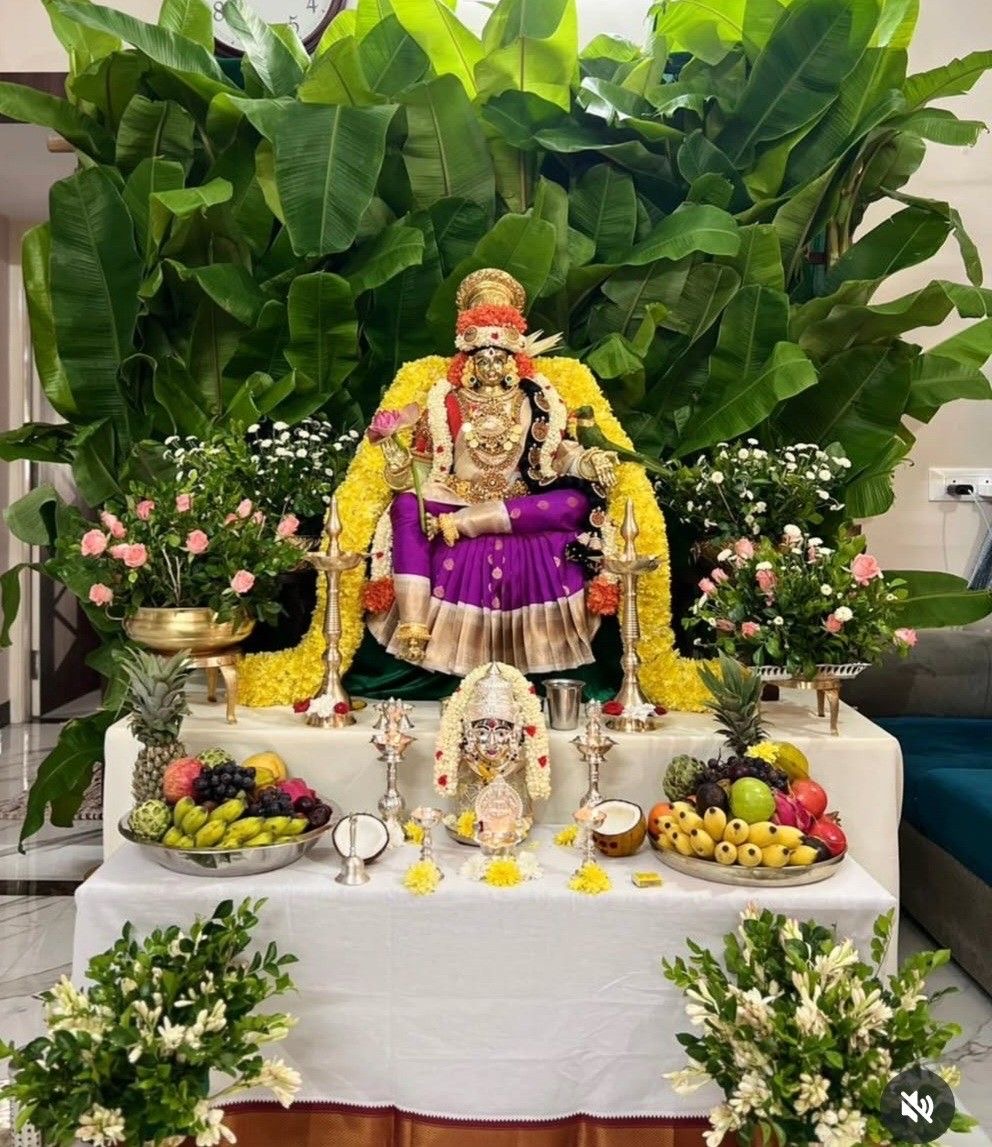 Traditional pooja setup with banana leaves and flowers